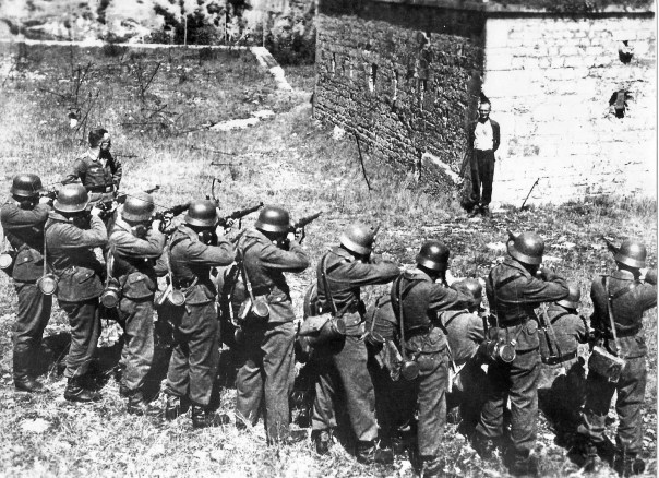 Georges Blind smiles as he faces a German firing squad